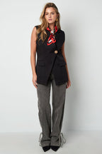 De mouwloze blazer